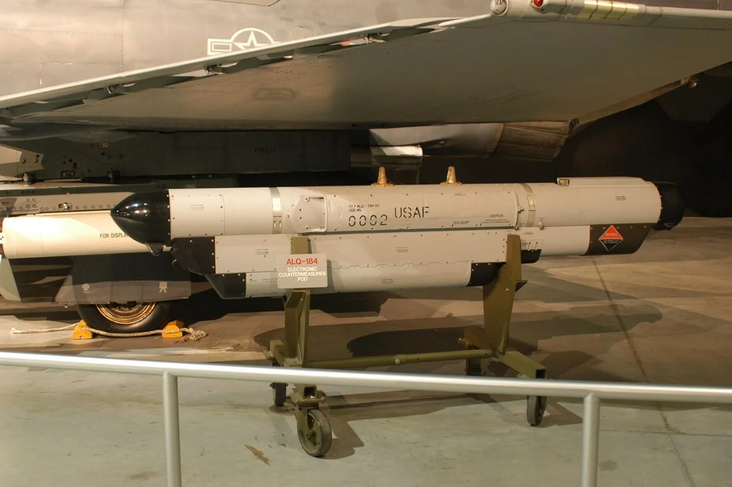 Raytheon AN/ALQ-184 jammer pod for electronic countermeasures at USAF museum.-20 Inch By 30 Inch Laminated Poster With Bright Colors And Vivid Imagery-Fits Perfectly In Many Attractive Frames